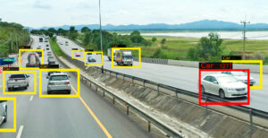 Object detection bounding boxes drawn on vehicles in a road scene